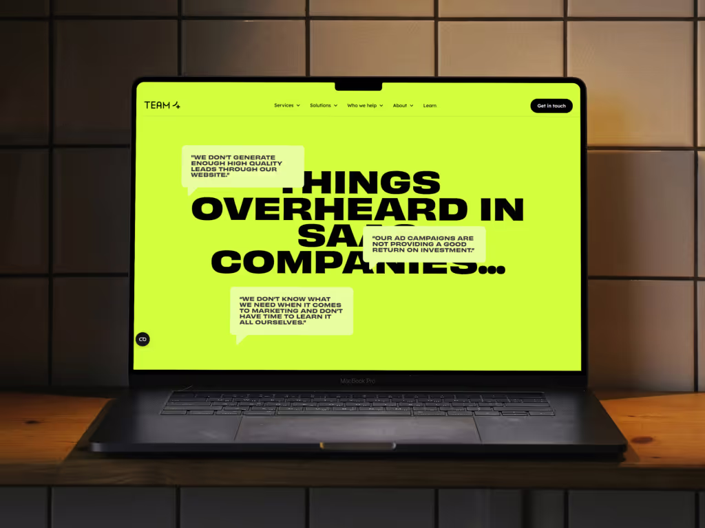 A macbook showing an interactive section on the Team 4 site